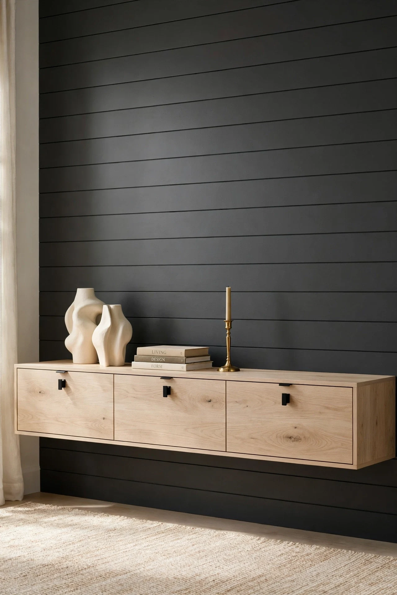 Floating white oak console against a charcoal horizontal shiplap living room wall